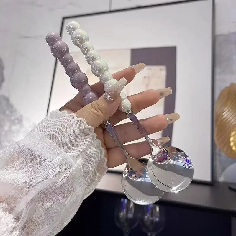 Luxa-Cuillère design à manche perlé en acier inoxydable finition dorée